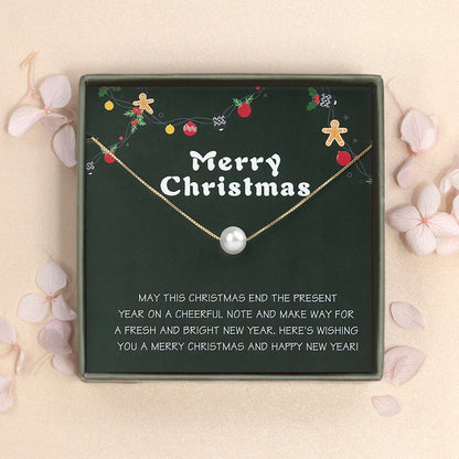 "Merry Christmas" Card and Pearl Necklace