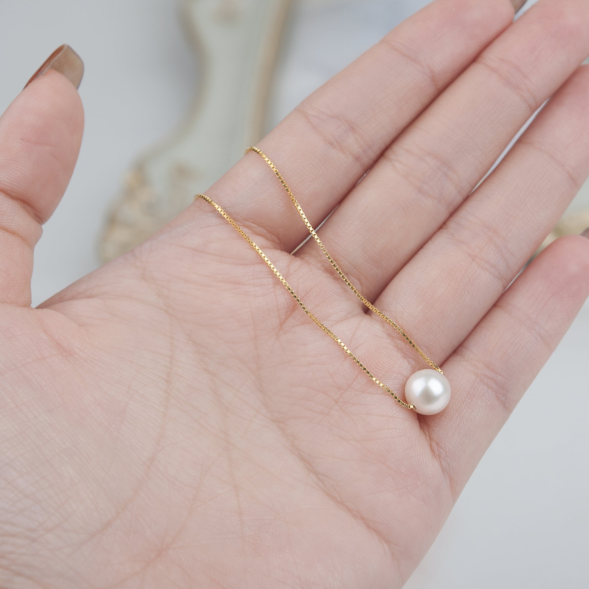 "Merry Christmas" Card and Pearl Necklace