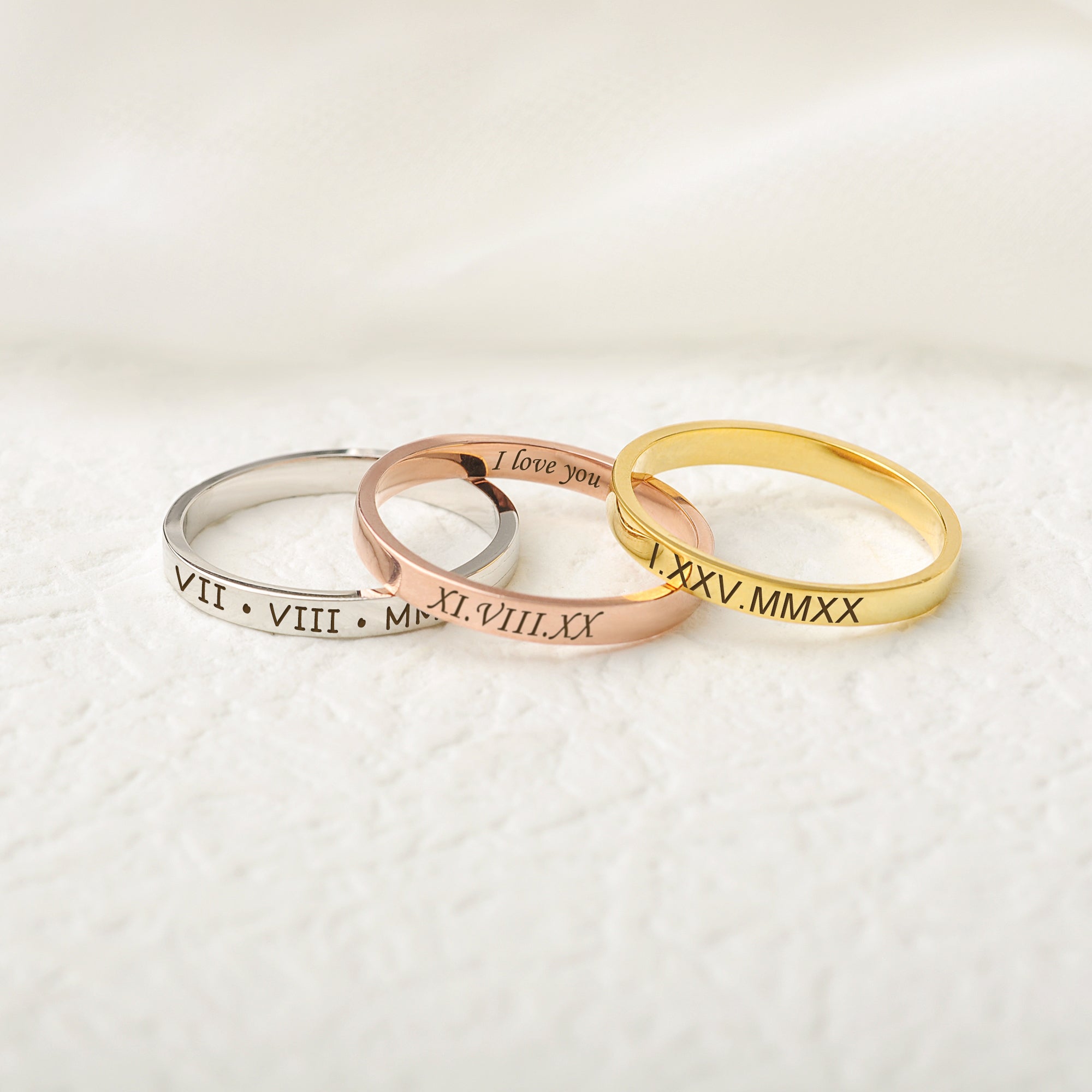 couple rings with engraved names